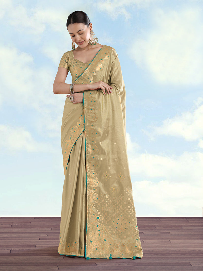 Cream Banarasi tissue silk saree with intricate paisley zari woven patterns.