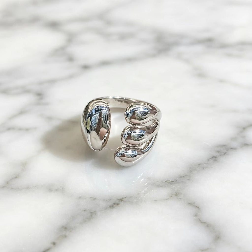 Handcrafted geometric silver open-ring with modern industrial design