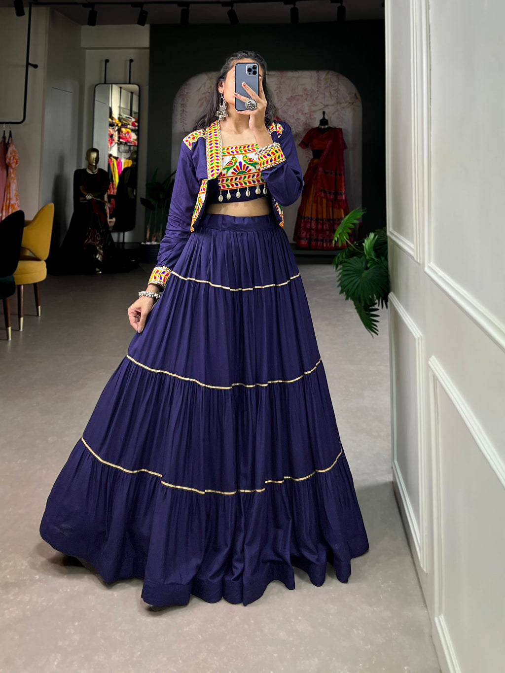 Navy blue pure rayon lehenga choli set featuring Gota Patti accents and matching koti for festive wear.