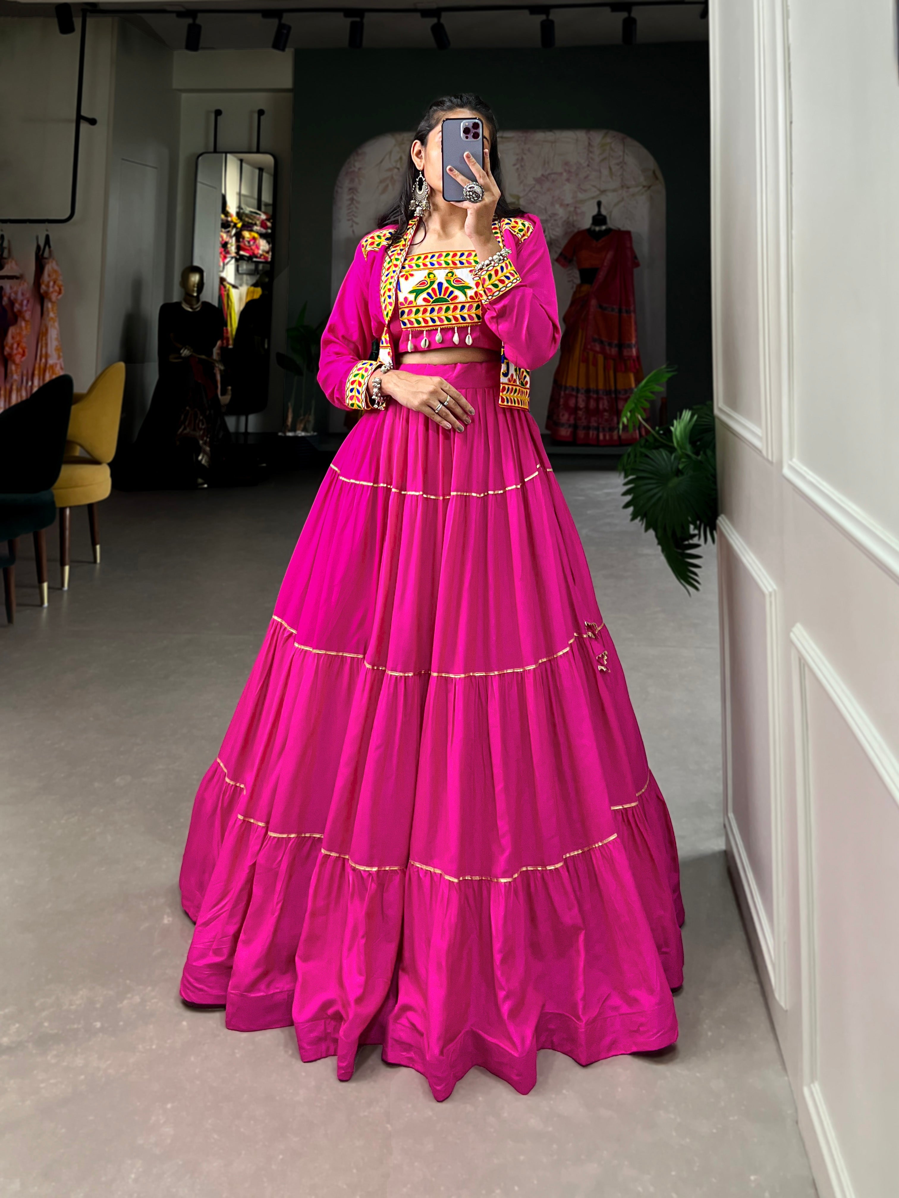 A pink pure rayon lehenga choli set featuring Gota Patti work and a matching jacket for Navratri.