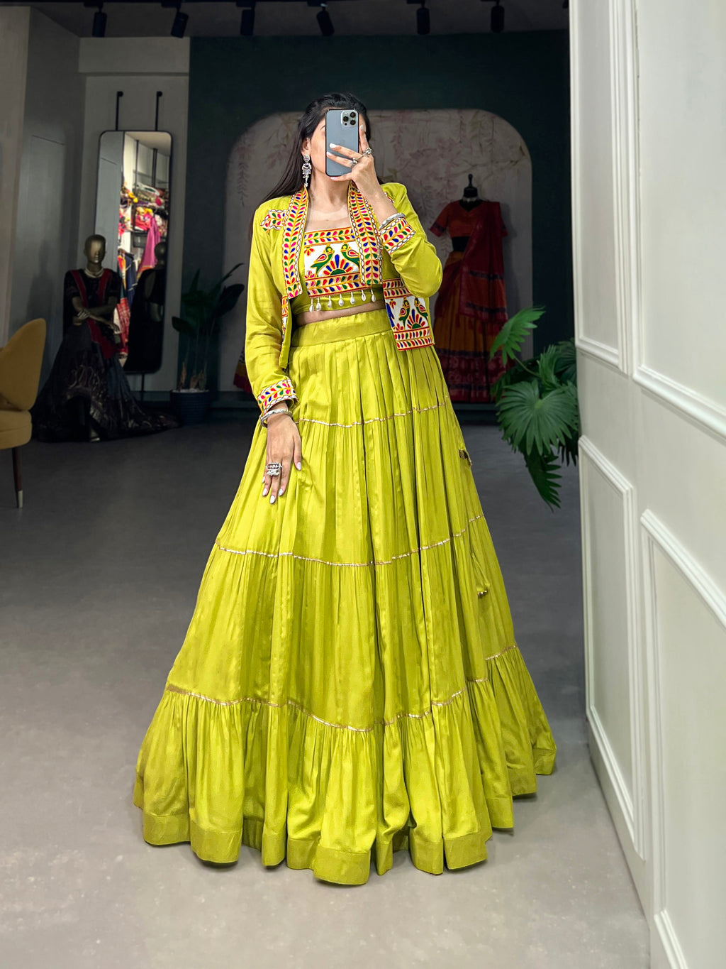 Parrot green pure rayon lehenga choli with traditional Gota Patti detailing and matching koti jacket.