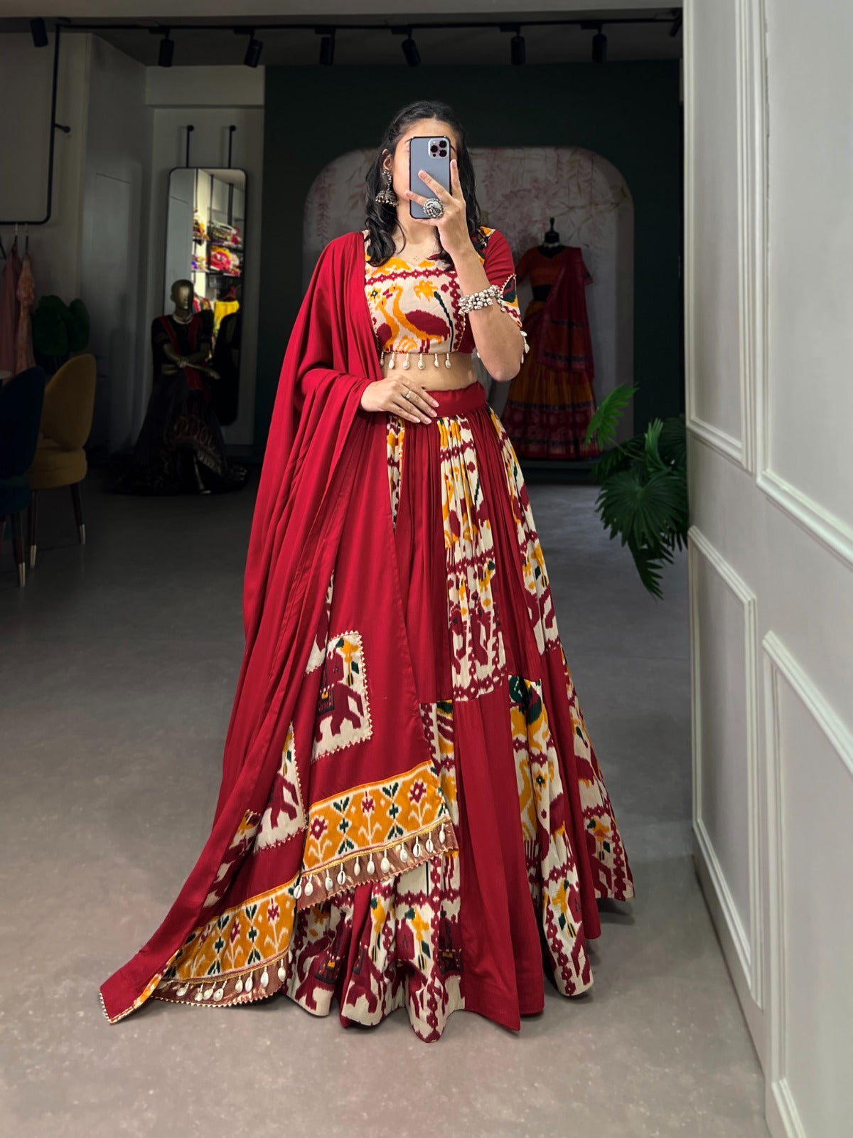 Maroon lehenga choli featuring printed silk details and a matching dupatta