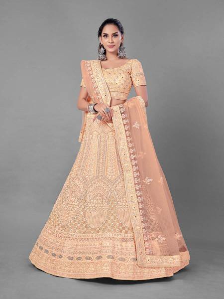 Peach bridal lehenga with heavy Dori, Zari, and Zarkan embroidery on soft net fabric
