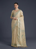 Elegant cream Banarasi satin silk saree with gold zari border and traditional butti work