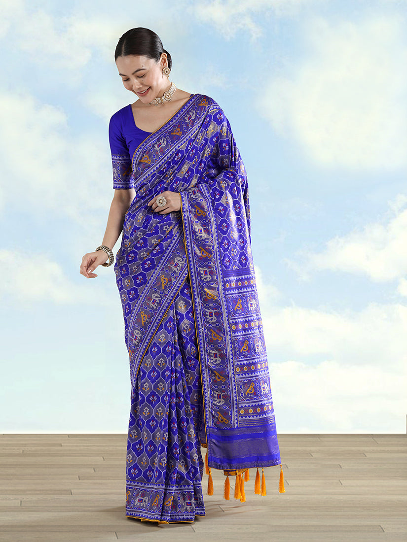 Navy blue satin silk saree adorned with traditional Patola patterns and intricate elephant zari motifs