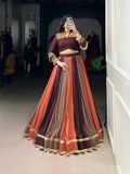 Multicolor embossed pure rayon lehenga choli with lace detailing, featuring maroon, brown, and burnt-orange tones.