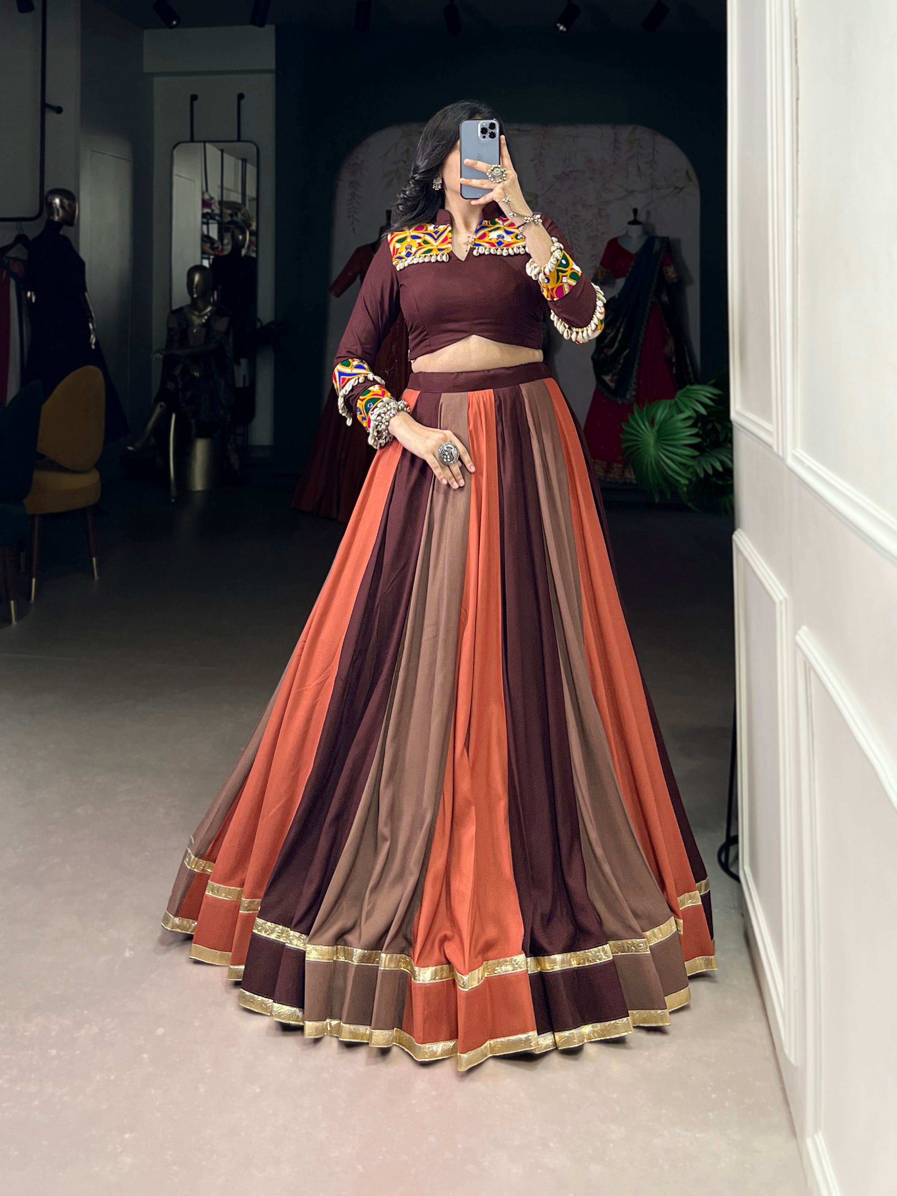 Multicolor embossed pure rayon lehenga choli with lace detailing, featuring maroon, brown, and burnt-orange tones.