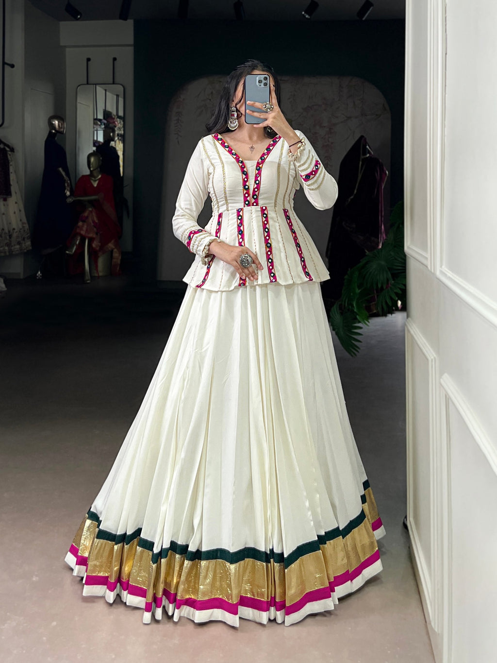 White rayon lehenga choli with embossed texture and lace detailing