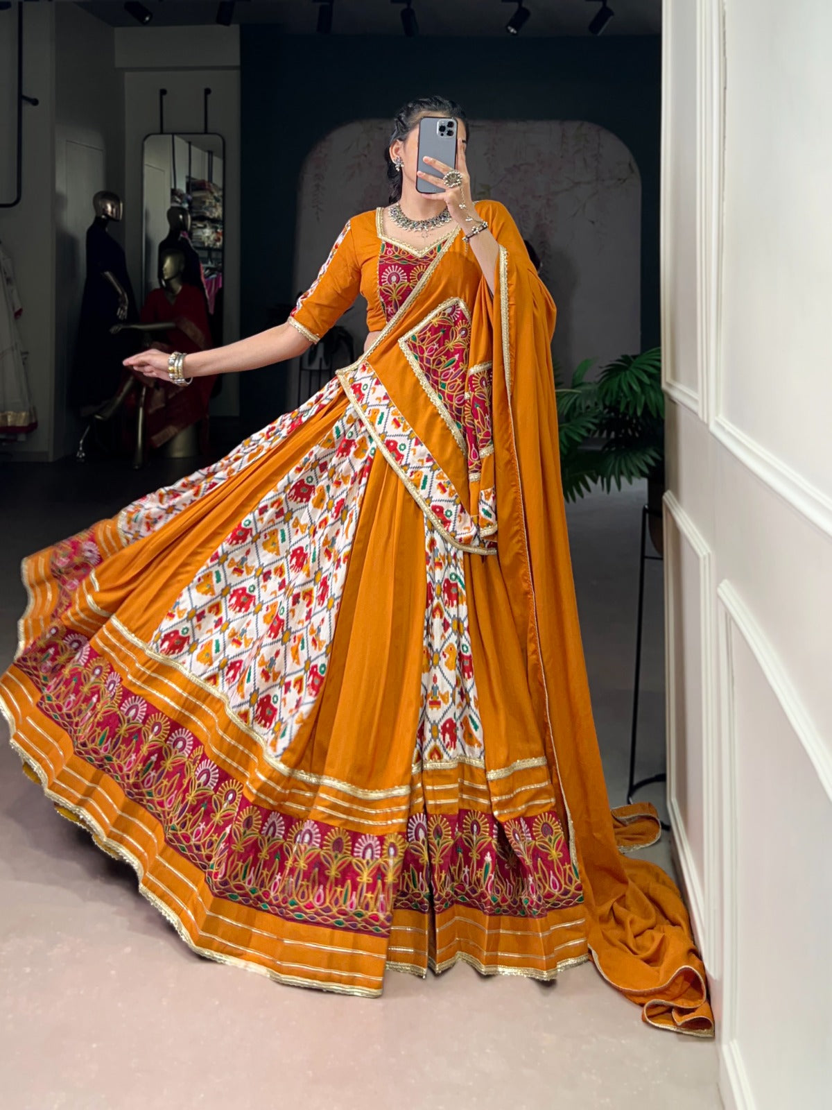 Mustard Printed Silk Patola Lehenga Choli with Gamthi Work