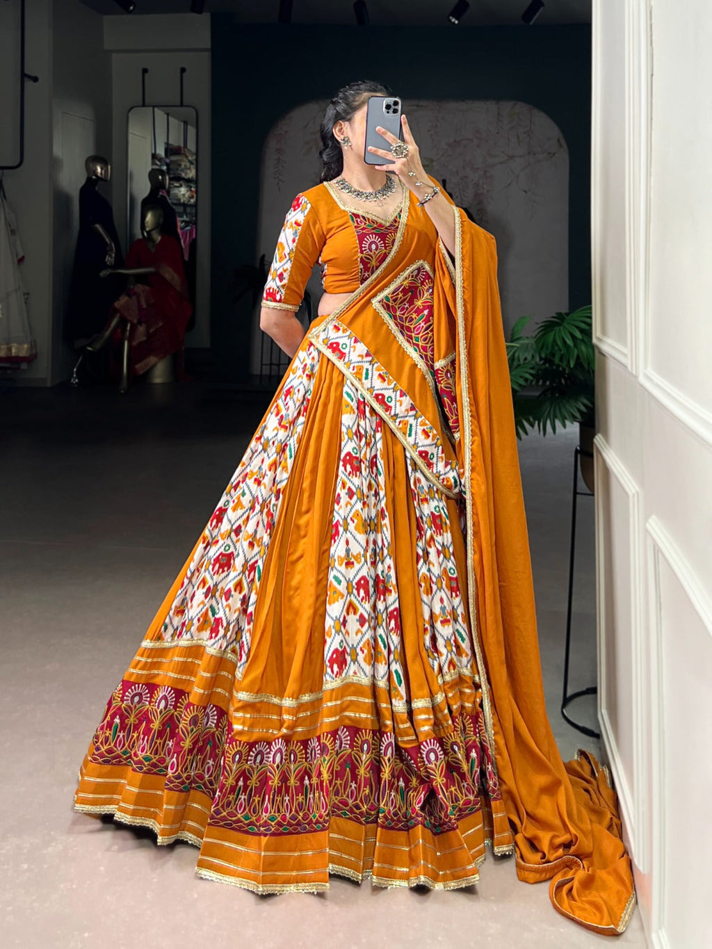 Mustard Printed Silk Patola Lehenga Choli with Gamthi Work