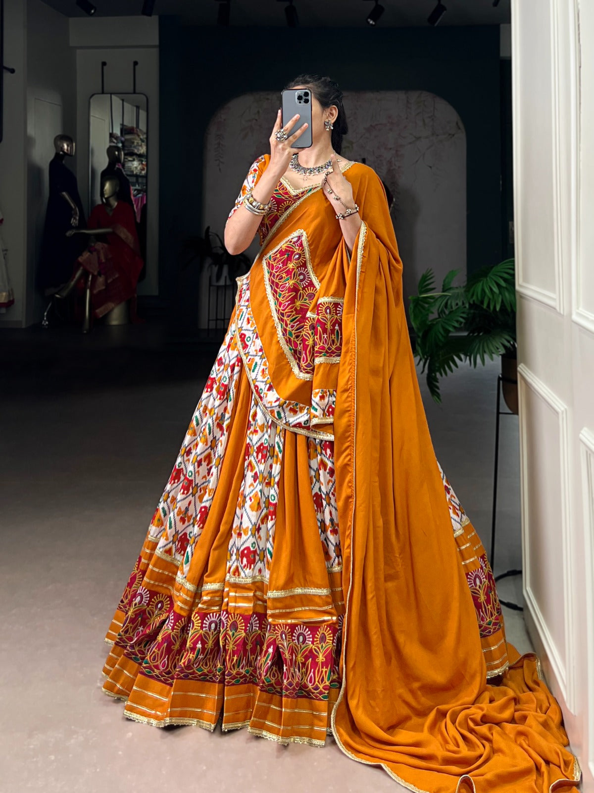 Mustard Printed Silk Patola Lehenga Choli with Gamthi Work