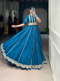 Firozi chiffon lehenga choli featuring Bandhej print, gold Gotta Patti lace, and sequin work for women.