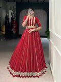 A vibrant red chiffon lehenga choli with traditional Bandhej print, sequin embellishments, and Gotta Patti lace.