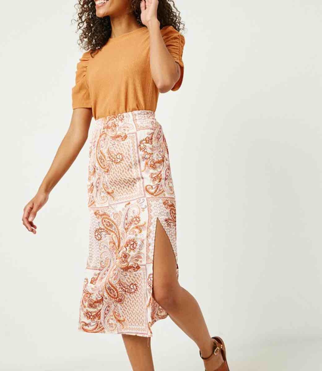 Liberty midi skirt featuring a terracotta and orange bohemian print on a white background.