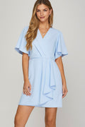 Feminine mini dress with surplice neckline, ruffles, and flutter sleeves