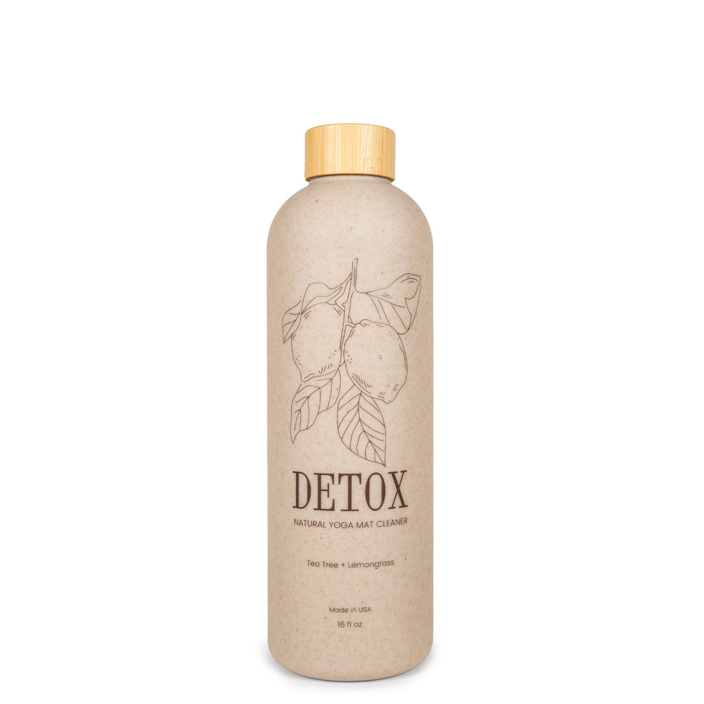 16 fl oz bottle of natural yoga mat cleaner in a minimalist beige and tan aesthetic.