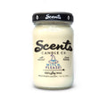 Witch Please scented soy wax candle in a clear mason jar with a black lid and white label.