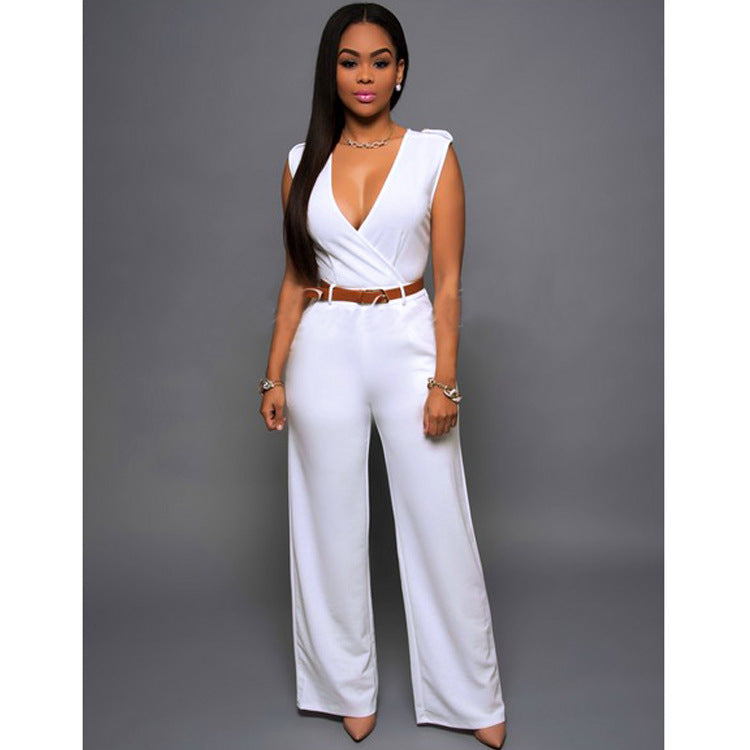 A woman wearing a modern, sleeveless, wide-leg V-neck jumpsuit in a solid color.