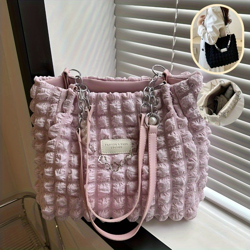 Pink and white pleated bubble shoulder bags with silver chain detail displayed side by side.