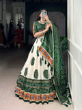 Off-white Tasar silk lehenga with dark green geometric Bandhej and intricate Gamthi work.