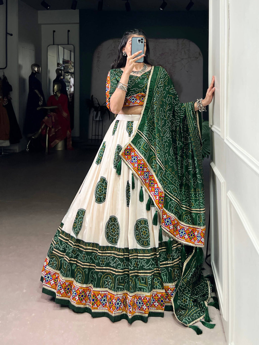 Off-White Tasar Silk Geometric Bandhej Lehenga with Dark Green Details