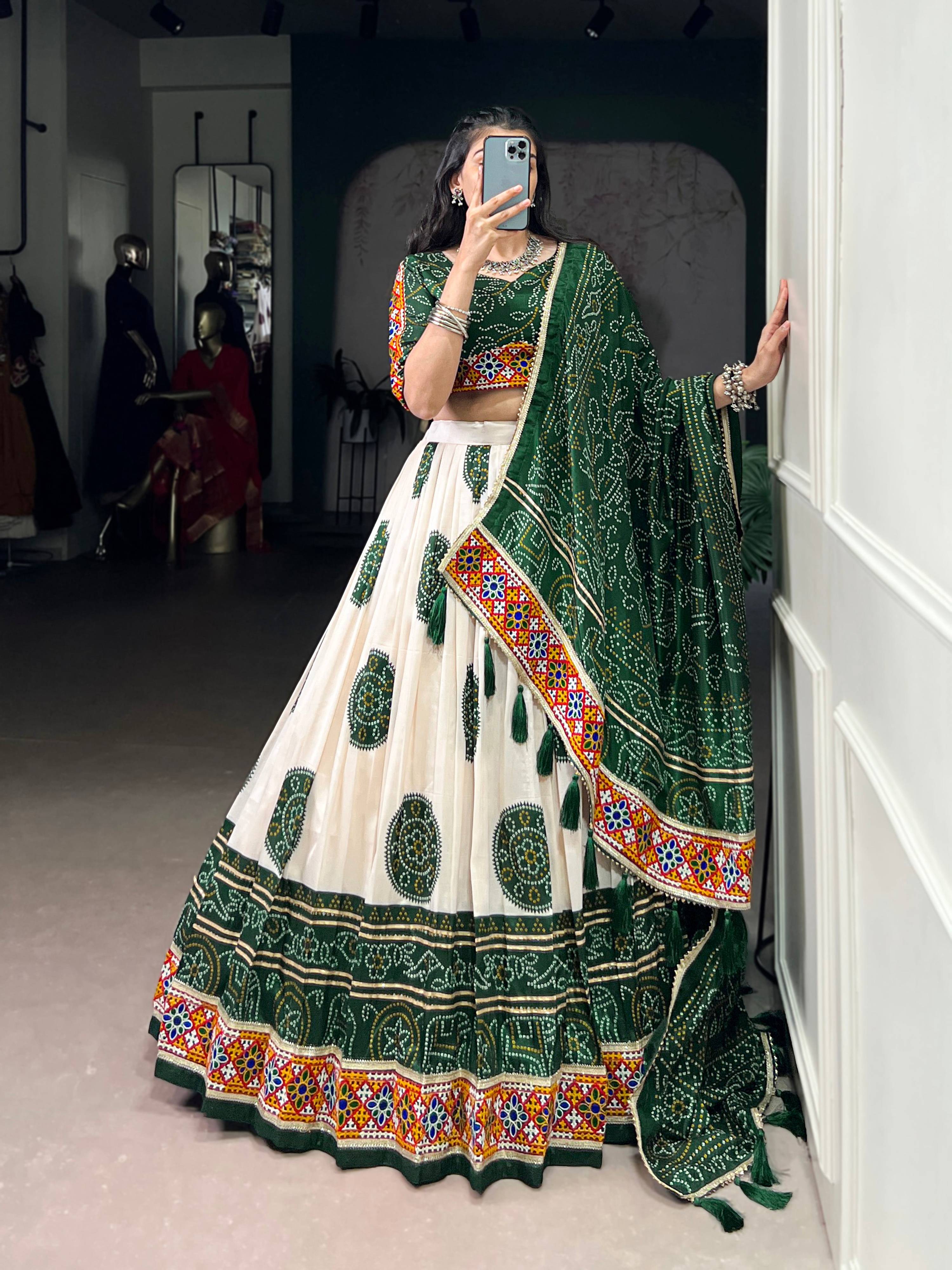 Off-White Tasar Silk Geometric Bandhej Lehenga with Dark Green Details