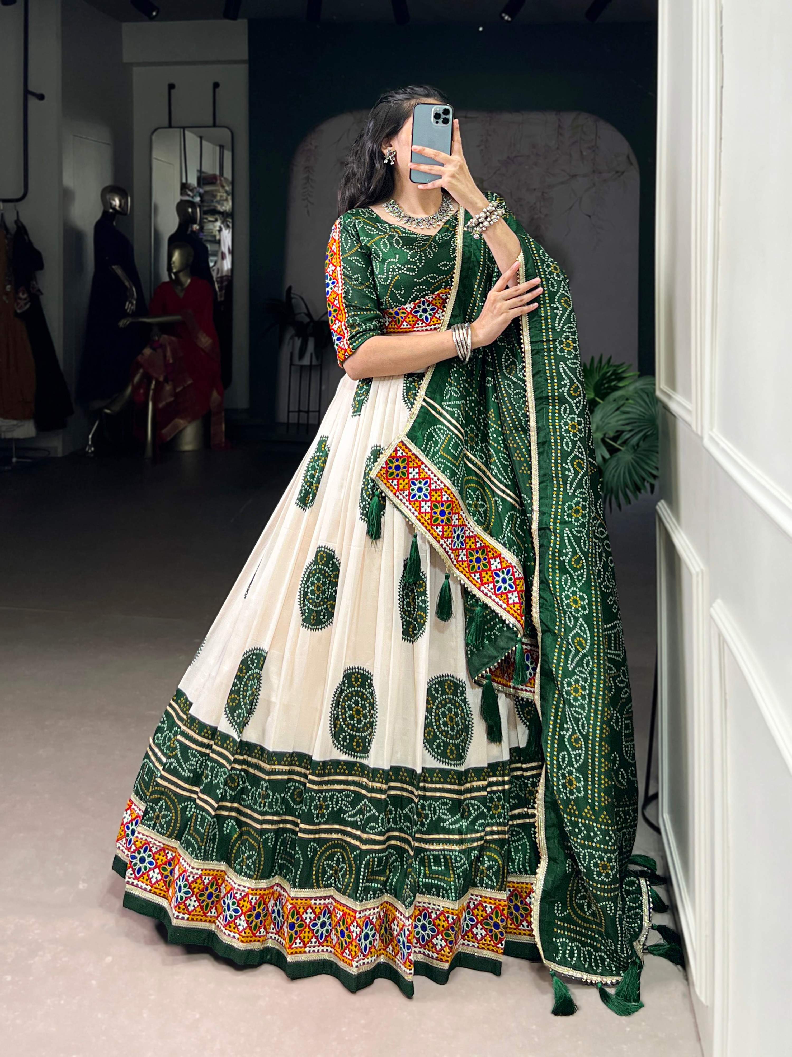 Off-White Tasar Silk Geometric Bandhej Lehenga with Dark Green Details