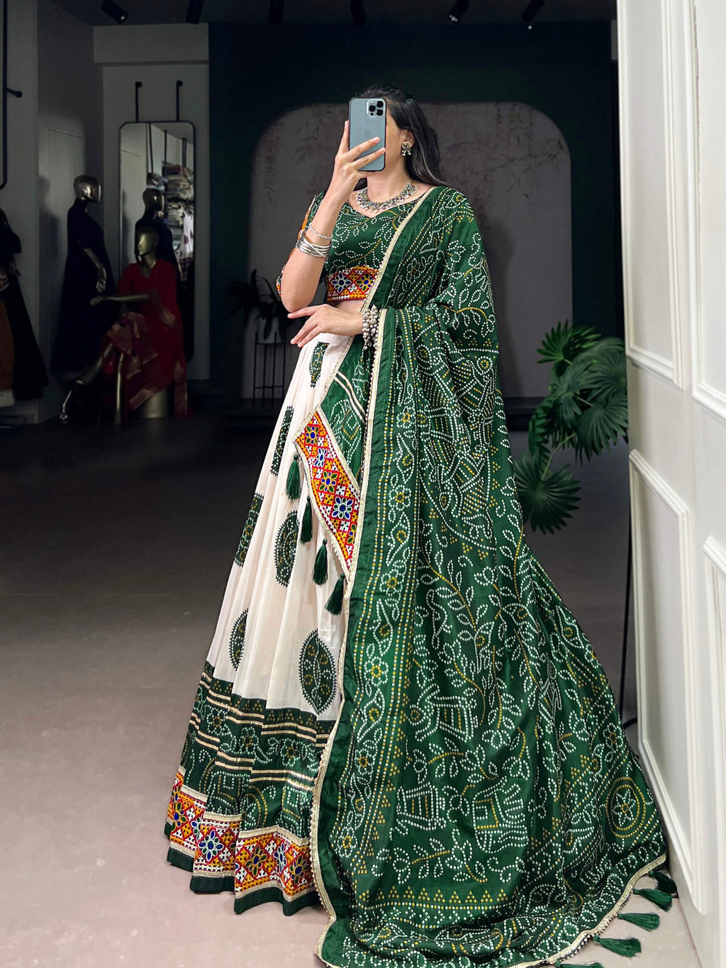 Off-White Tasar Silk Geometric Bandhej Lehenga with Dark Green Details