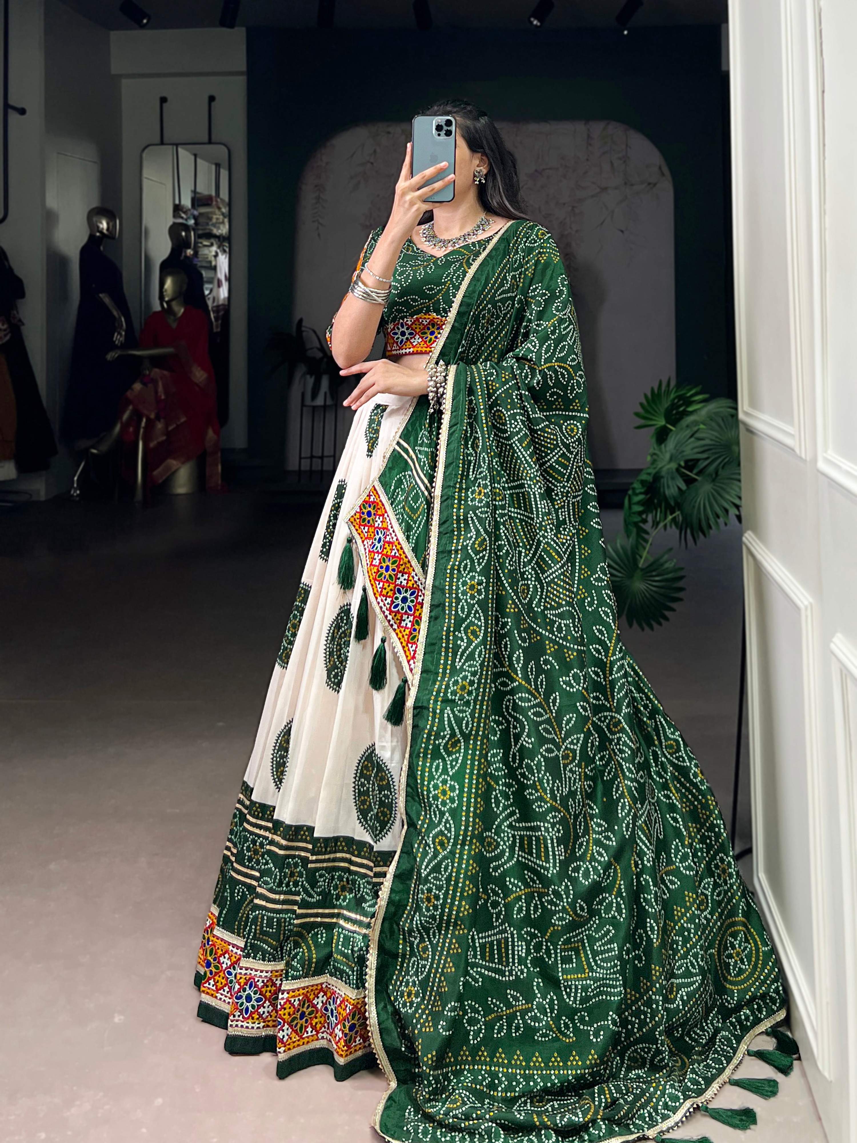 Off-White Tasar Silk Geometric Bandhej Lehenga with Dark Green Details