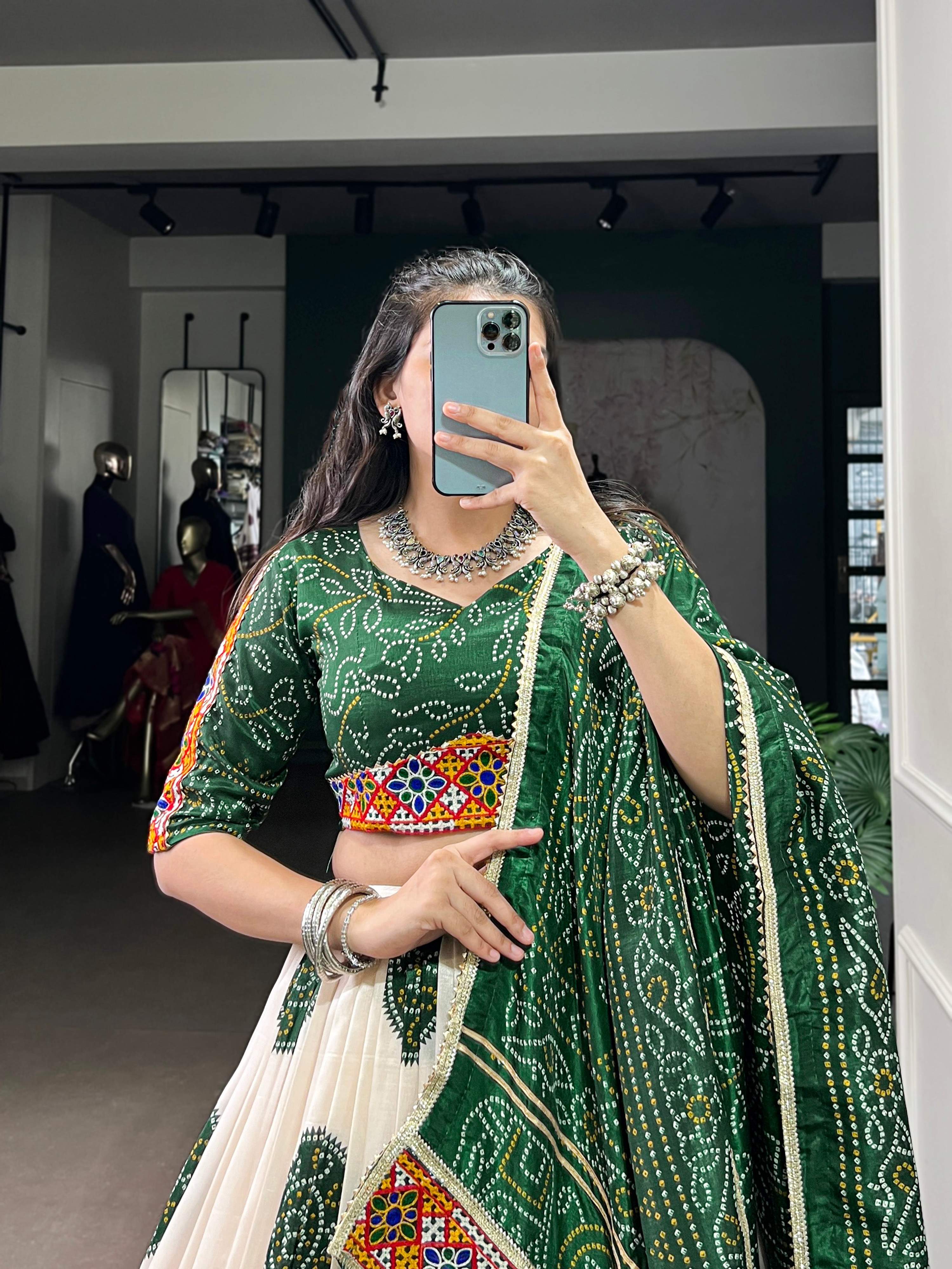 Off-White Tasar Silk Geometric Bandhej Lehenga with Dark Green Details