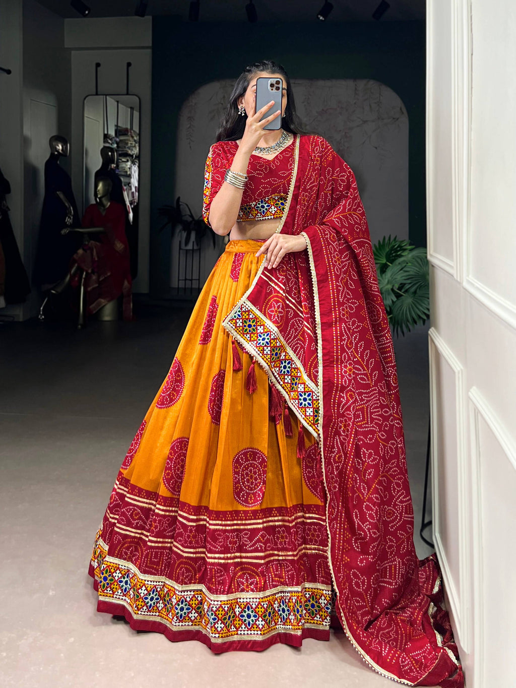 Mustard Tasar Silk lehenga with Bandhej print and Gamthi mirror work