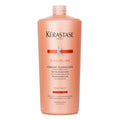 Kérastase Discipline Fondant Fluidealiste orange and white bottle for unruly hair