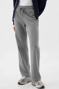 A pair of grey women's drawstring lounge pants with a relaxed fit, featuring side pockets and an elastic waistband.