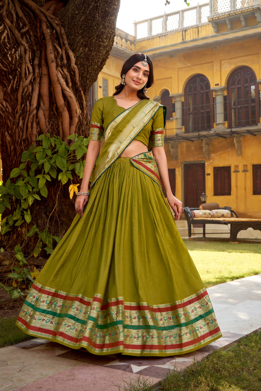 Mehendi colored Chanderi lehenga choli with ornate Zari weaving details.