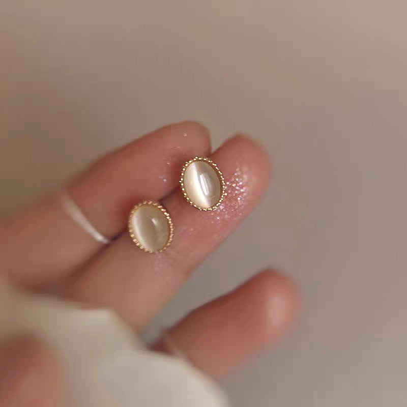 Minimalist gold heart stud earrings suitable for everyday wear