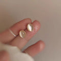 Minimalist gold heart stud earrings suitable for everyday wear