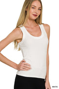 Close up of a woman wearing a white ribbed scoop neck tank top