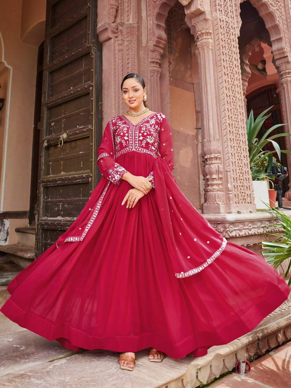 Vibrant red georgette kurta set featuring sequence embroidery and a graceful long-line fit.