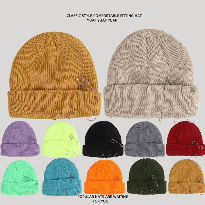 A collection of colorful Harajuku Style Fashion women's knitted beanie hats with safety pin embellishments and distressed details.