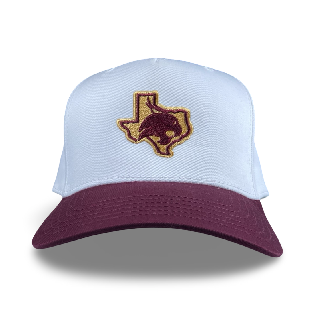 Texas Bobcat trucker hat featuring a maroon and gold embroidered patch with a Texas state outline and Bobcat silhouette.
