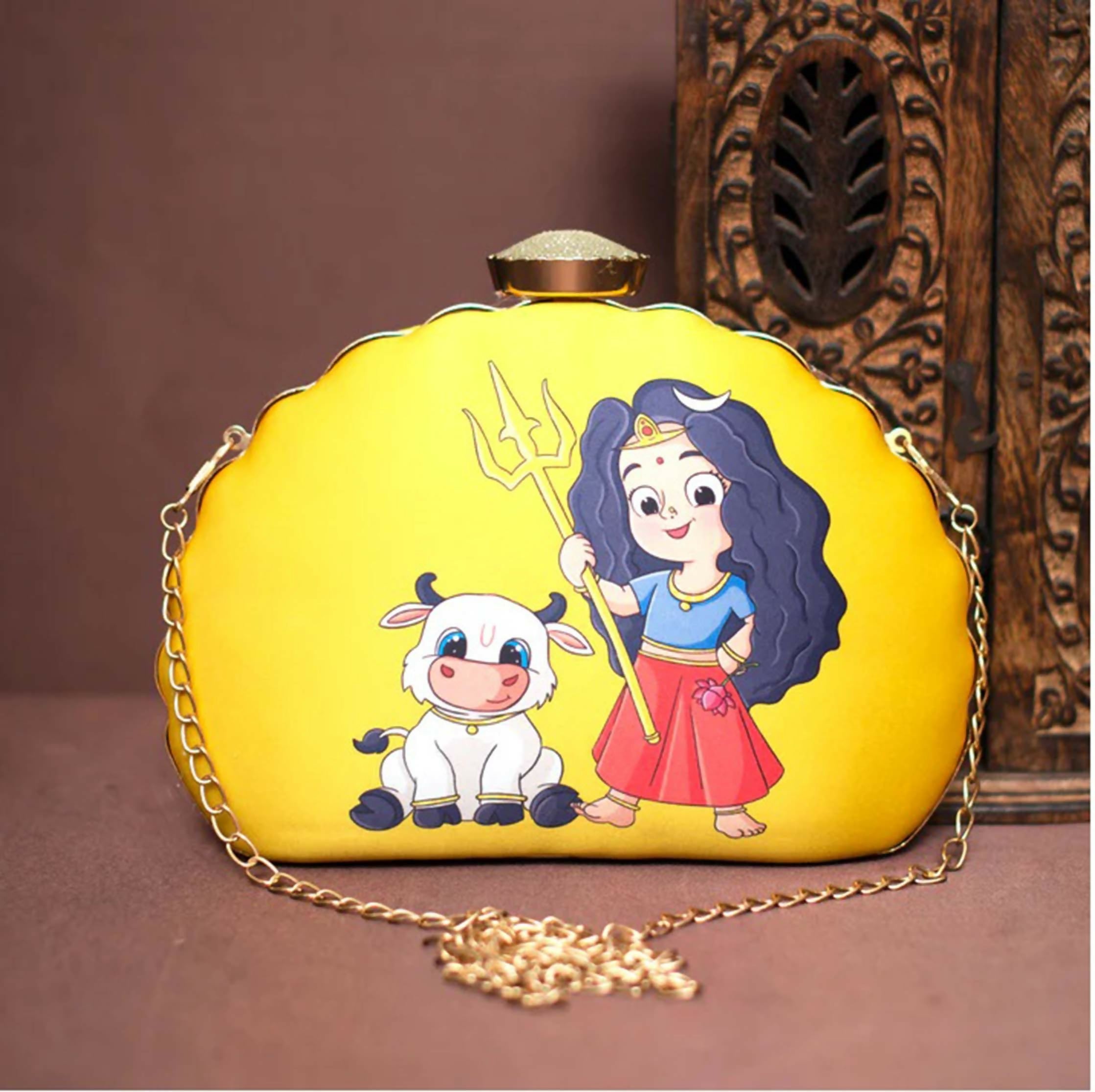 Yellow D-shape clutch featuring a traditional Durga print design