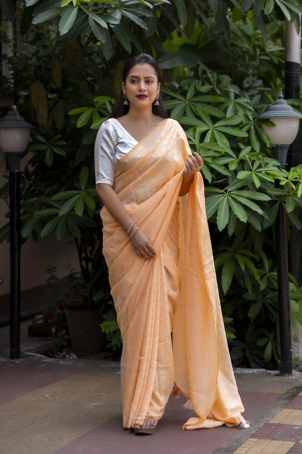 Yellow poly georgette saree with white leaf woven design and mirror work blouse