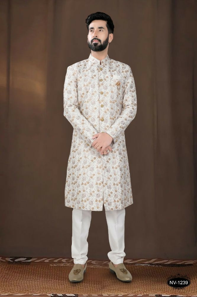 Toddler wearing an off-white silk kurta with intricate thread and sequence embroidery.