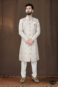 Toddler wearing an off-white silk kurta with intricate thread and sequence embroidery.