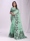 Vibrant Rama green linen cotton saree with a natural texture and matching blouse