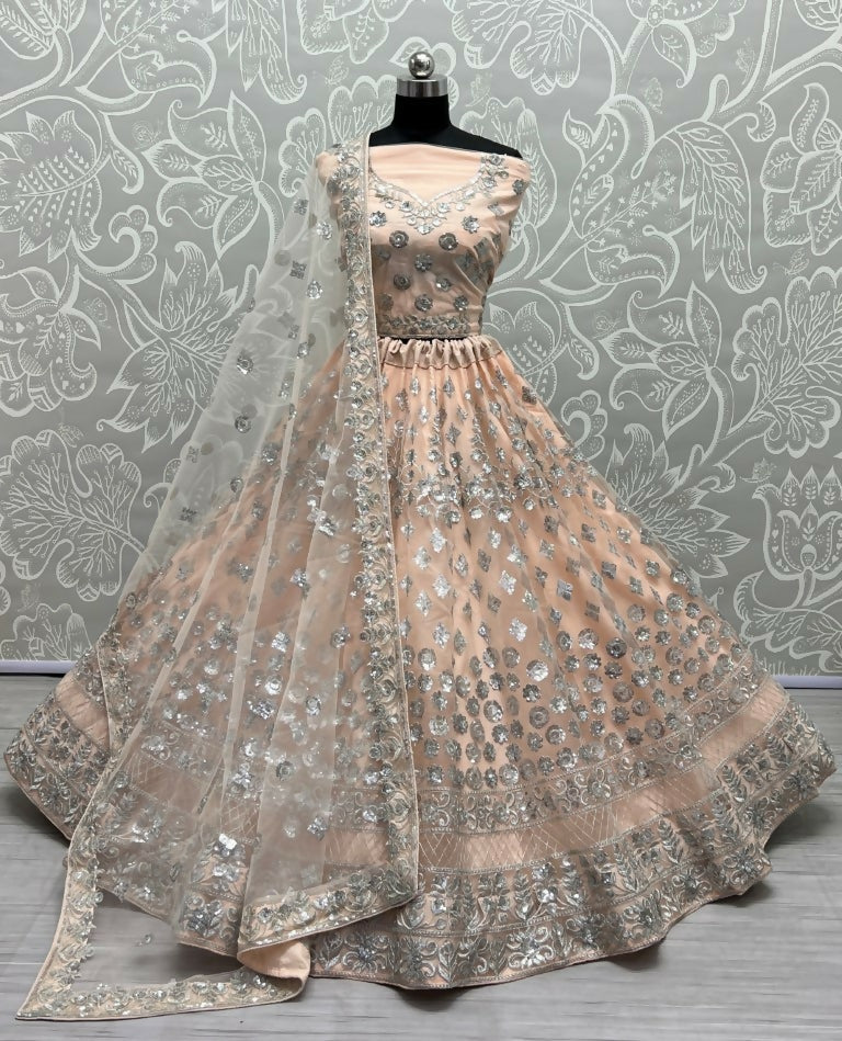 Peach bridal net lehenga choli with zari and thread embroidery