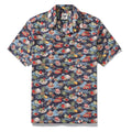 1970s vintage style Hawaiian shirt with navy and multicolor tropical scenery print and camp collar.
