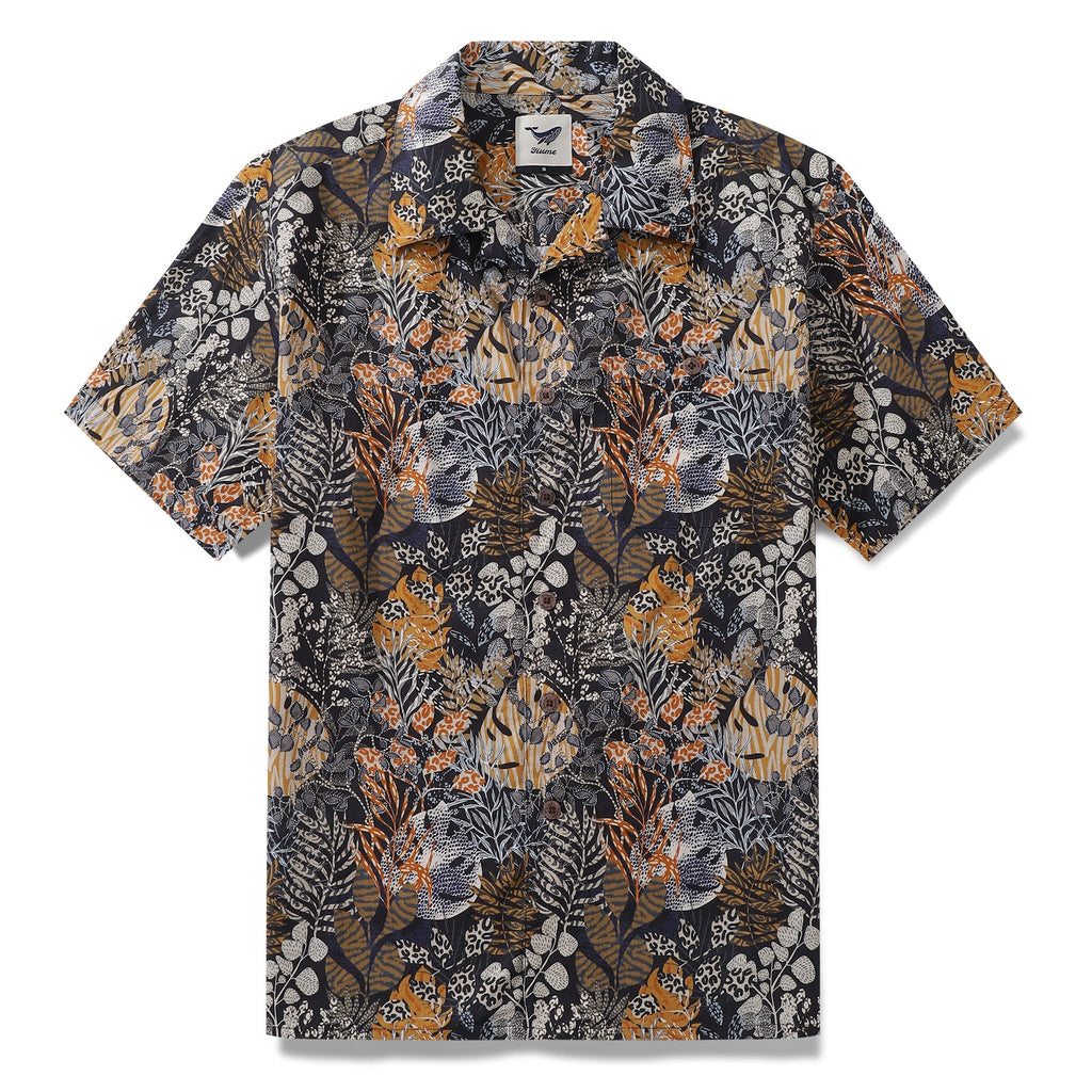 Tropical Hawaiian shirt featuring animal-patterned leaves in black, mustard-yellow, and white.