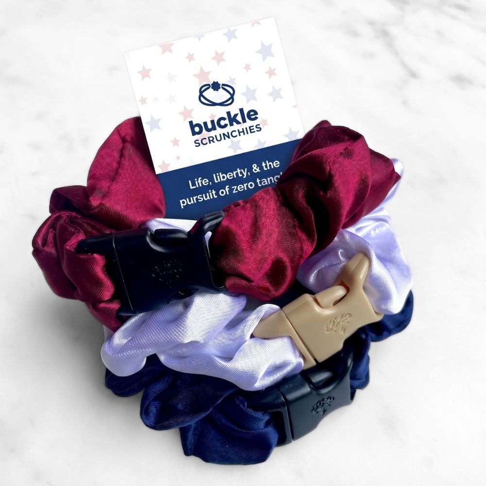 A 3-pack of satin buckle scrunchies in red, white, and blue colors.