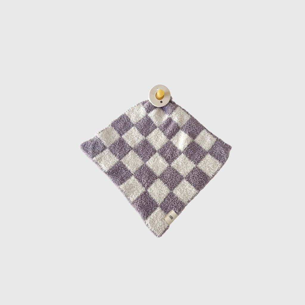 Grape Soda lovey made of microfiber feather yarn featuring a modern geometric knit pattern in grape purple and white.